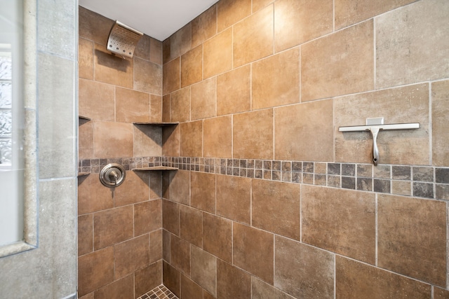 bathroom with tiled shower