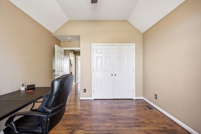 office featuring lofted ceiling and dark hardwood / wood-style flooring