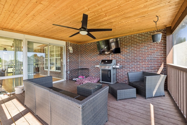 wooden deck featuring a grill and ceiling fan