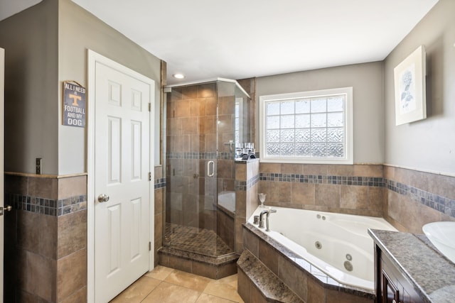 bathroom with vanity, plus walk in shower, and tile patterned flooring