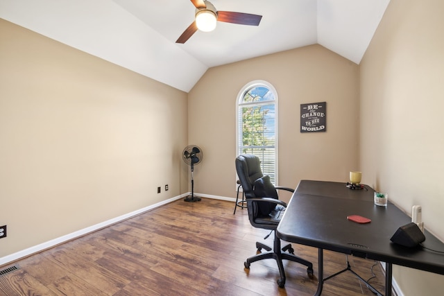 office space with vaulted ceiling, ceiling fan, and hardwood / wood-style floors