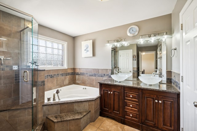 bathroom with vanity, shower with separate bathtub, and tile patterned flooring