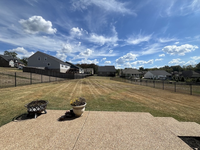 view of yard with a fire pit