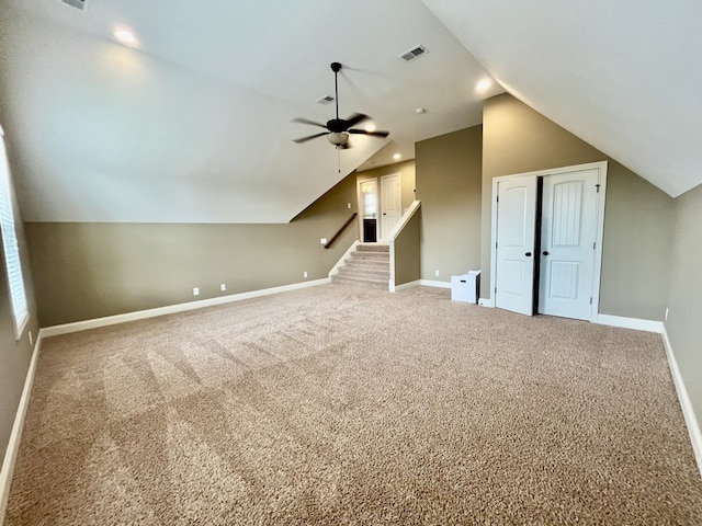 additional living space featuring carpet, ceiling fan, and lofted ceiling