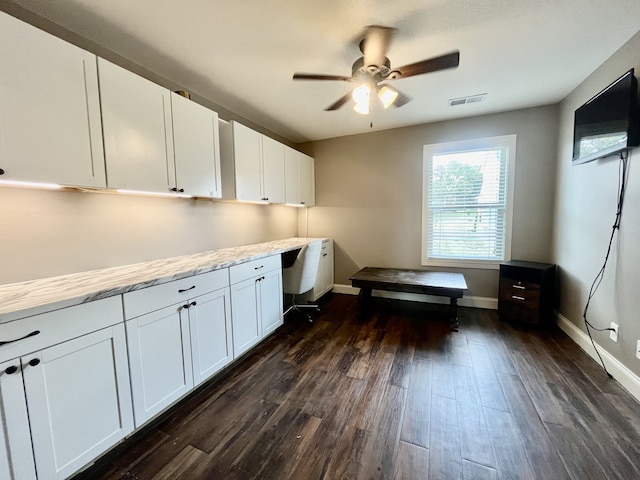 clothes washing area with ceiling fan and dark hardwood / wood-style flooring