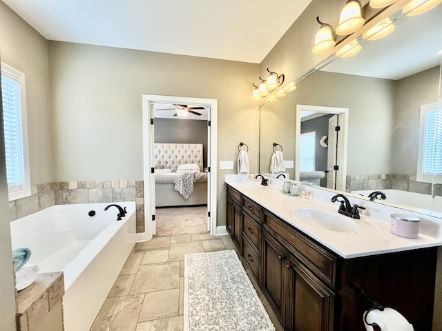 bathroom featuring tile patterned floors, ceiling fan, and vanity