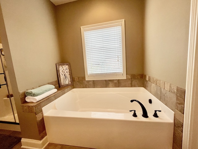 bathroom with a tub