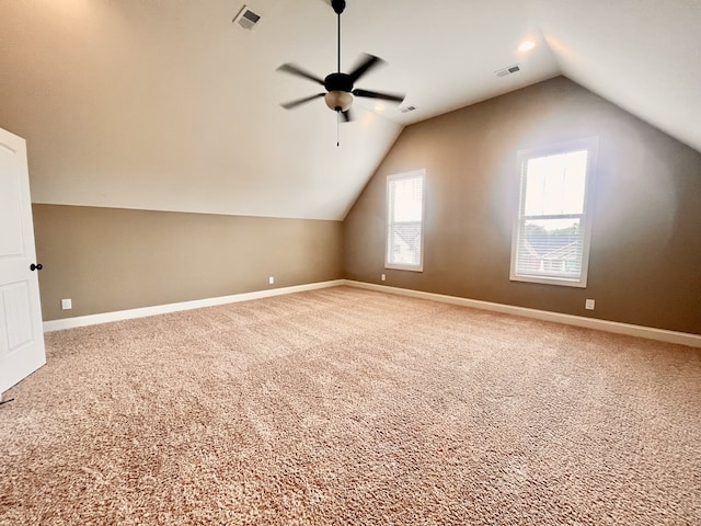 additional living space featuring ceiling fan, carpet floors, and lofted ceiling