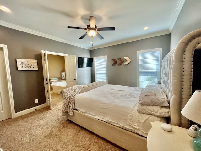 carpeted bedroom featuring ceiling fan and crown molding