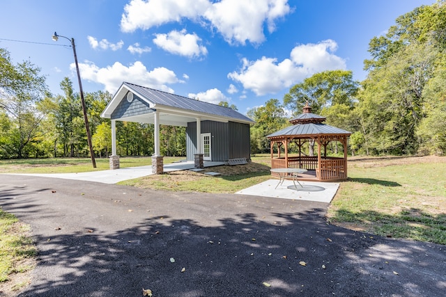 view of community with a gazebo and a yard