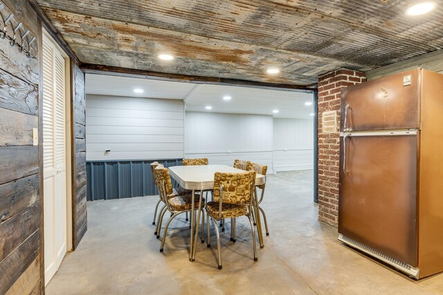 dining area with wood walls