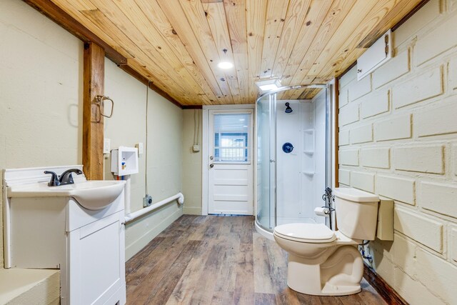 bathroom featuring vanity, wood ceiling, a shower with shower door, hardwood / wood-style flooring, and toilet