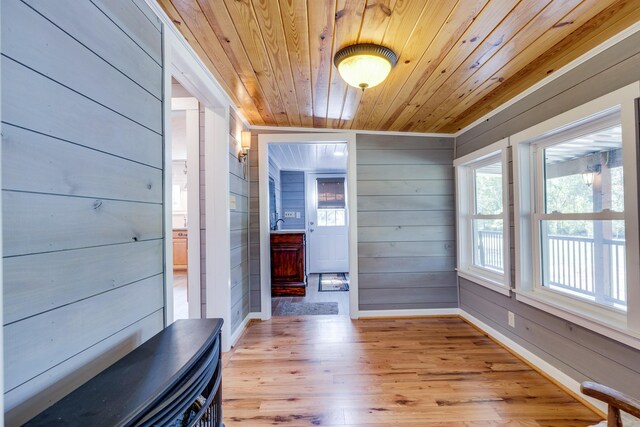 unfurnished sunroom with wooden ceiling