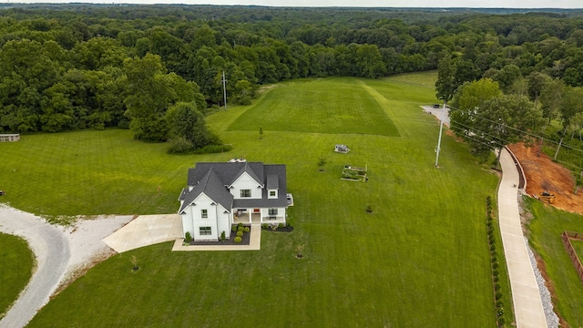 birds eye view of property with a rural view