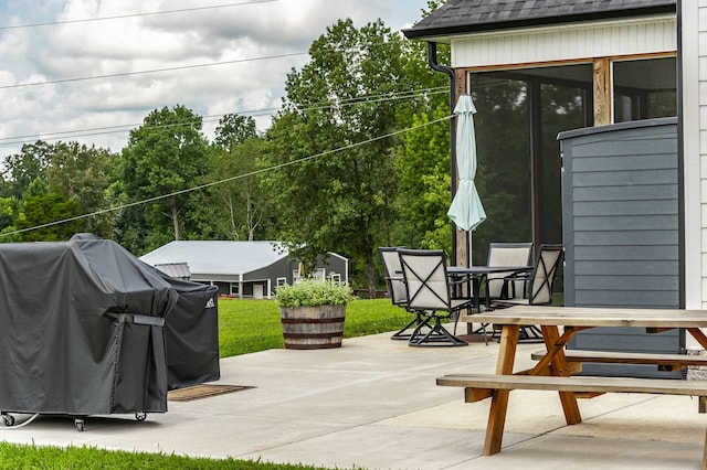 view of patio featuring a grill