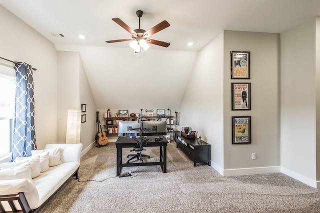 living room featuring ceiling fan, lofted ceiling, and carpet flooring