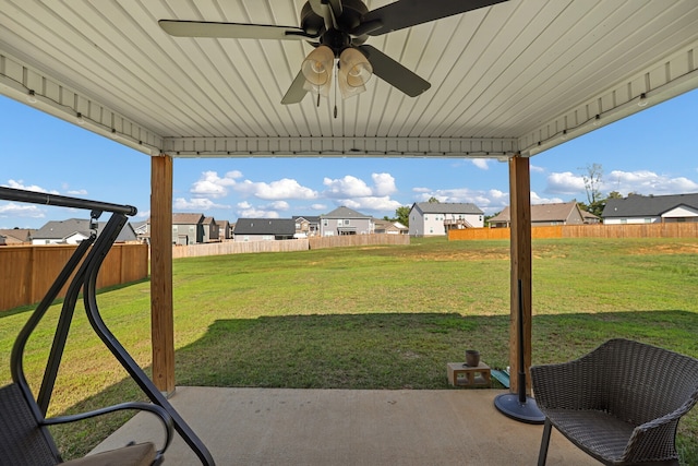 view of yard with a patio and ceiling fan