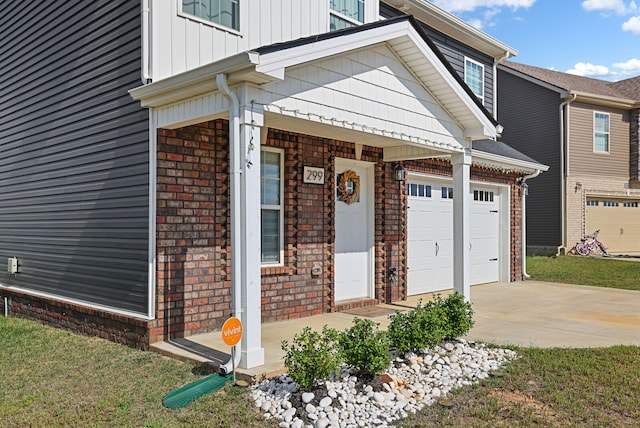 doorway to property with a garage