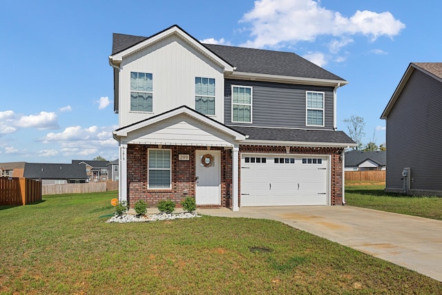 view of front of home featuring a garage and a front lawn