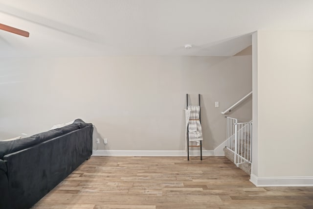 interior space with ceiling fan and light hardwood / wood-style flooring