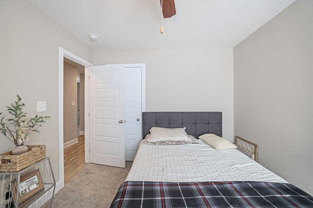 carpeted bedroom with ceiling fan