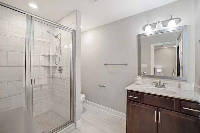 bathroom with walk in shower, vanity, and toilet