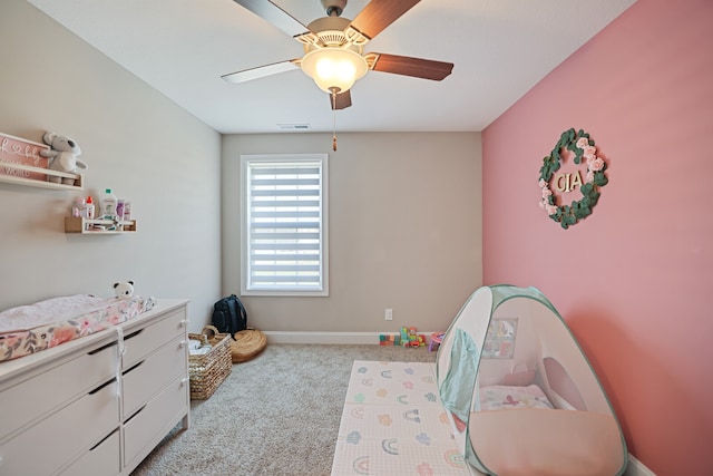 playroom with light carpet and ceiling fan