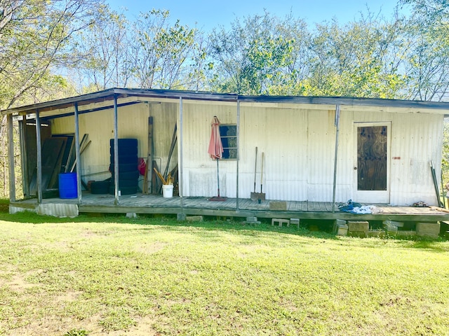 view of outdoor structure featuring a lawn