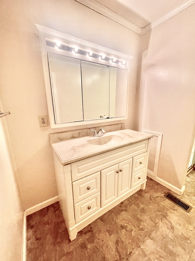 bathroom with vanity and crown molding