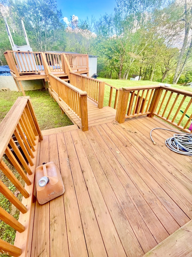 deck featuring a yard