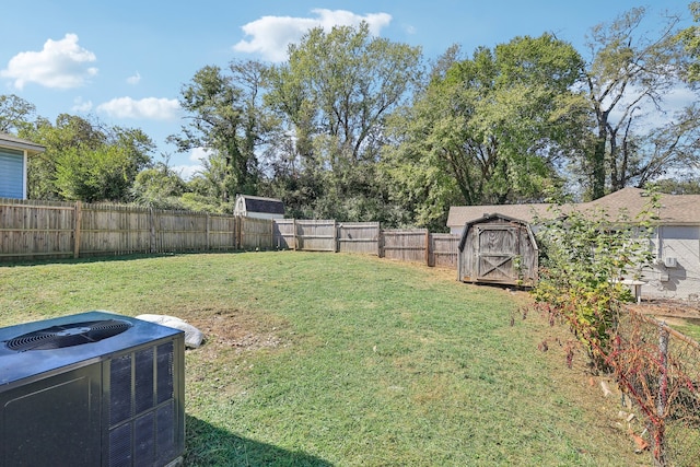 view of yard featuring cooling unit and a storage unit