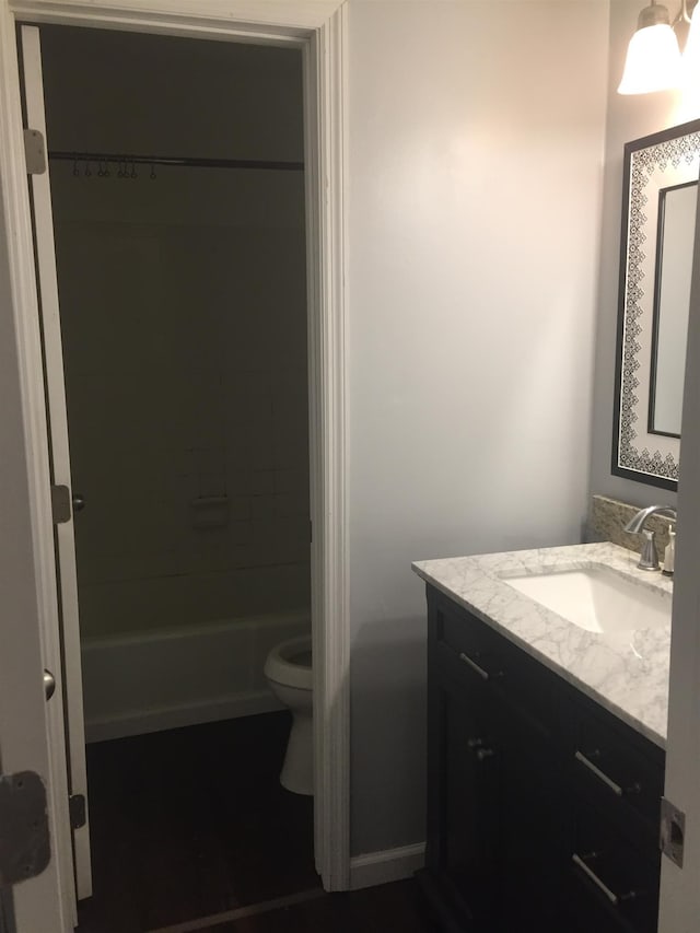 bathroom with toilet and vanity