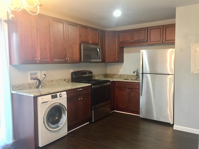 kitchen featuring dark hardwood / wood-style flooring, sink, light stone countertops, appliances with stainless steel finishes, and washer / dryer