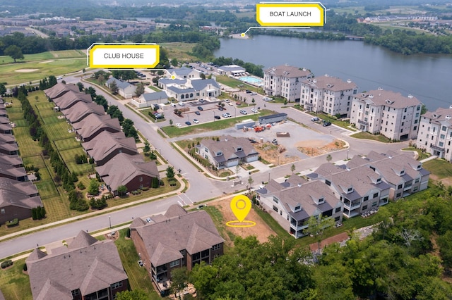 birds eye view of property with a water view