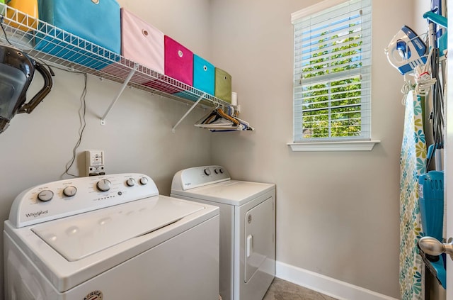 laundry area featuring washing machine and clothes dryer