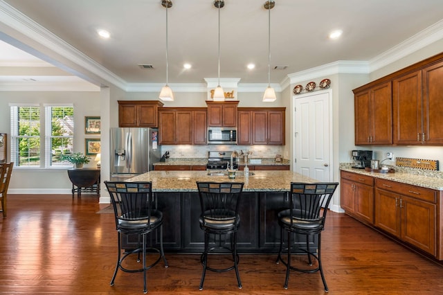 kitchen featuring stainless steel appliances, a center island with sink, and dark hardwood / wood-style flooring