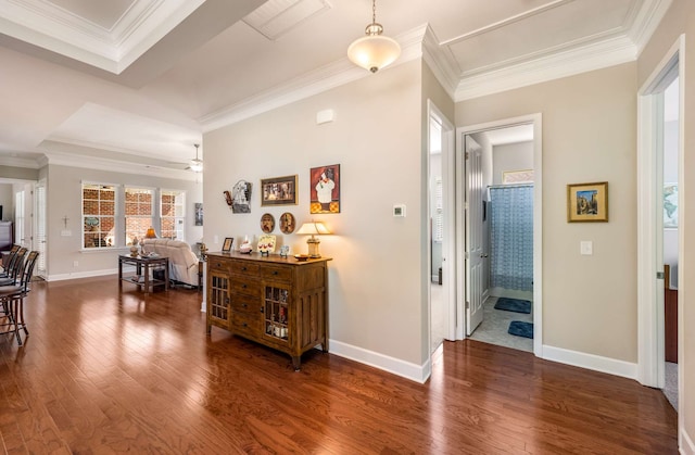 corridor featuring ornamental molding and dark hardwood / wood-style flooring