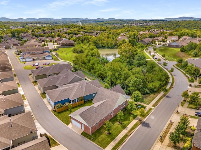 aerial view featuring a water and mountain view