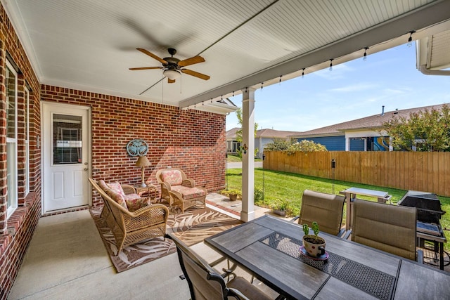 view of patio with an outdoor living space and ceiling fan