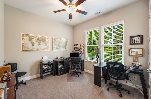 office area featuring ceiling fan and light carpet