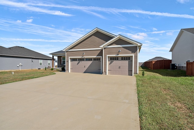 view of front of house featuring a front lawn, central air condition unit, and a garage