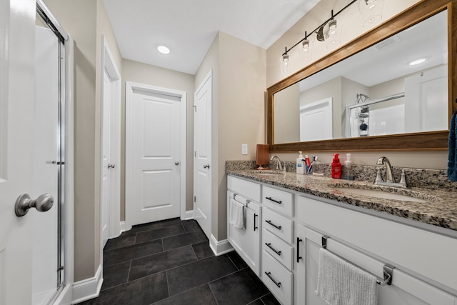 bathroom featuring a shower with shower curtain, tile patterned floors, and vanity