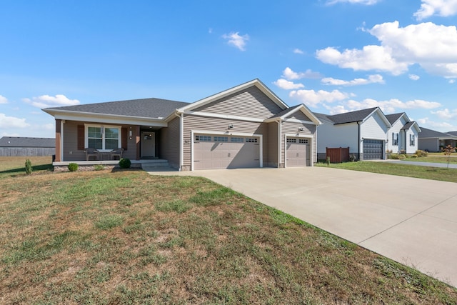 ranch-style home featuring a front lawn and a garage