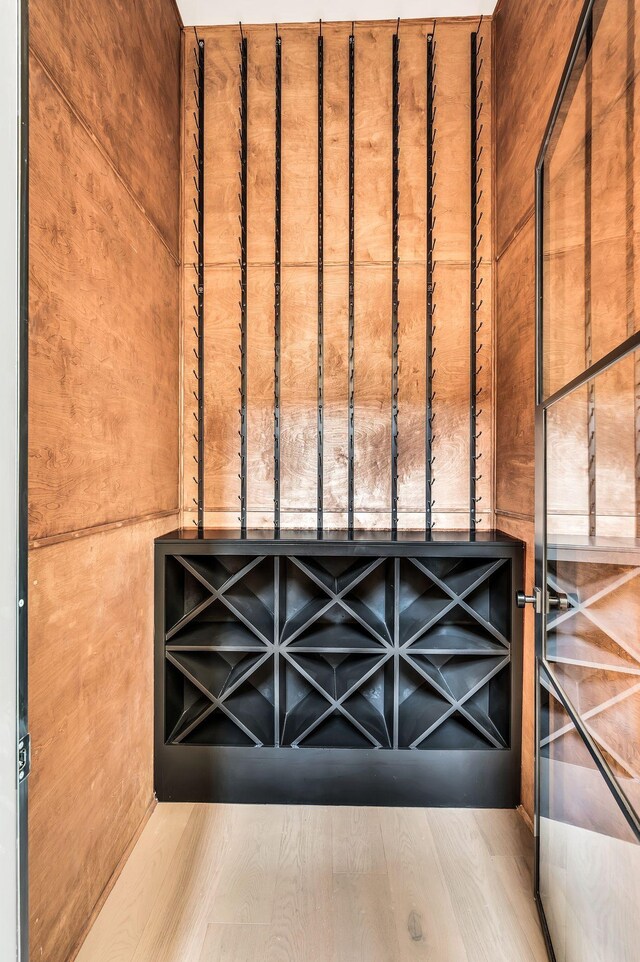 wine cellar with hardwood / wood-style floors