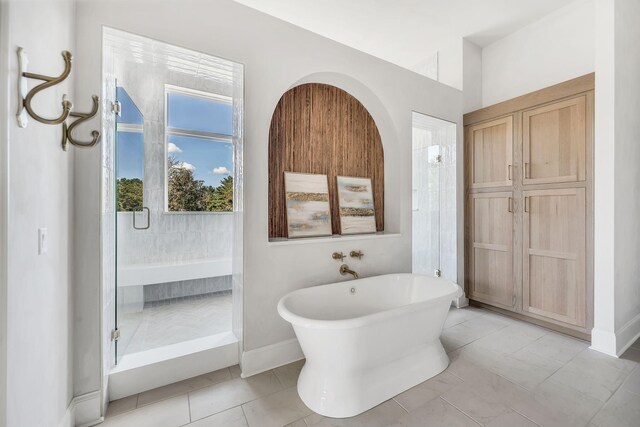 bathroom with plus walk in shower and tile patterned floors