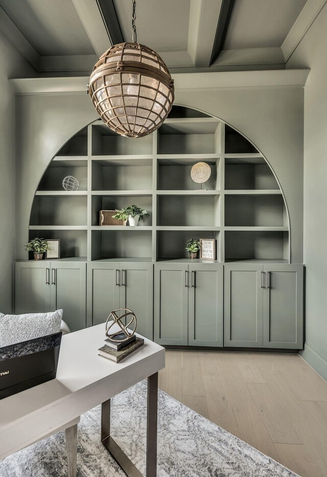 interior space featuring beamed ceiling and light hardwood / wood-style flooring