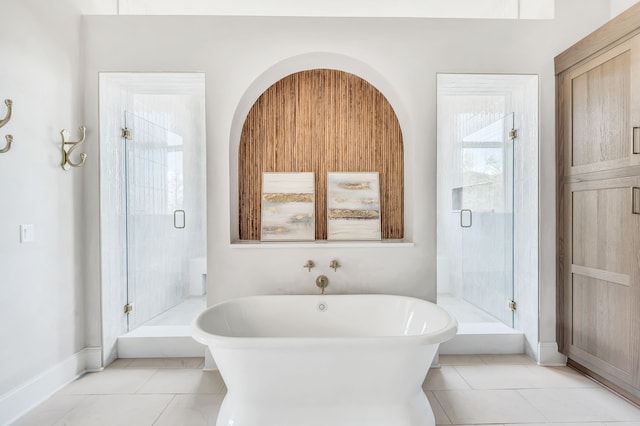 bathroom featuring shower with separate bathtub, plenty of natural light, and tile patterned floors