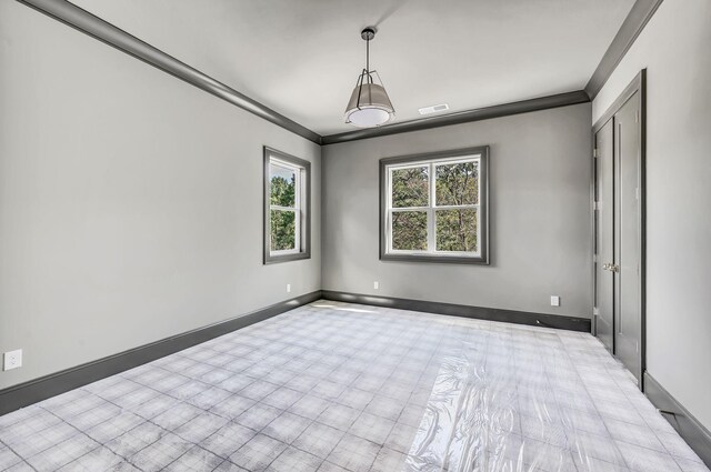 spare room featuring ornamental molding