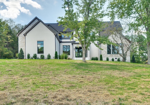 view of front of home with a front yard