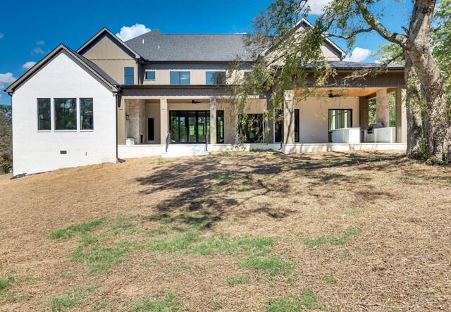 rear view of property featuring a patio area and ceiling fan